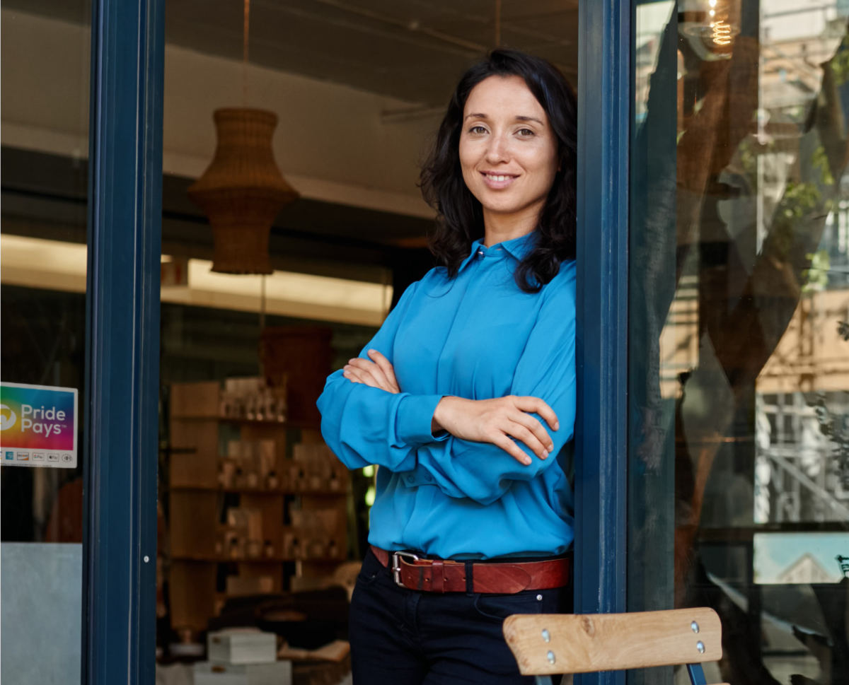 PridePays Merchant in front of their boutique